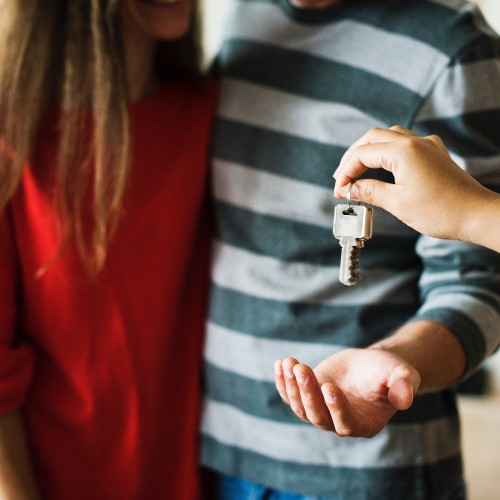 Couple being given apartment keys